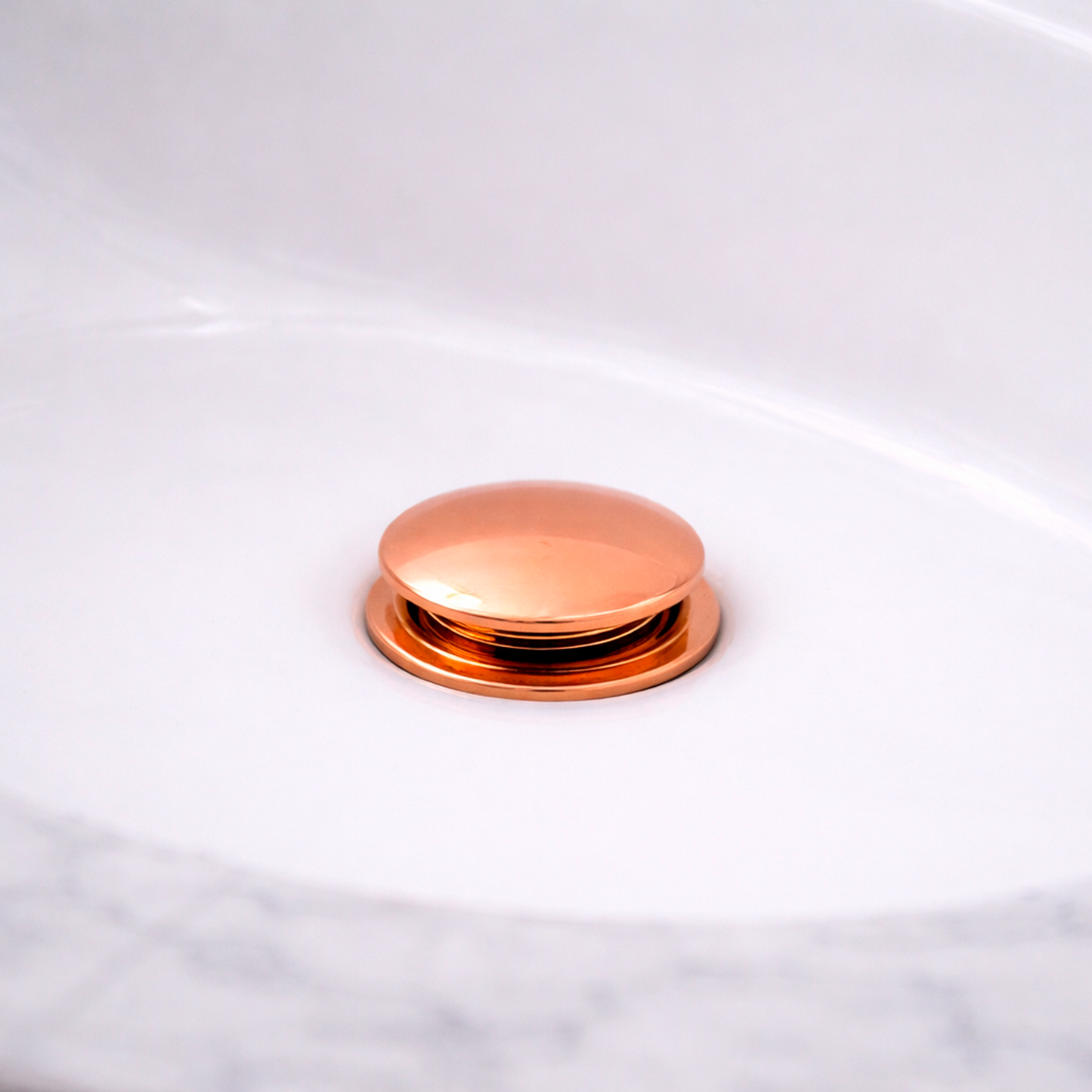 Desague de Push para Lavamanos Oro Rosa en Acero