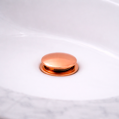 Desague de Push para Lavamanos Oro Rosa en Acero